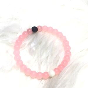 Pink rubber bracelet.